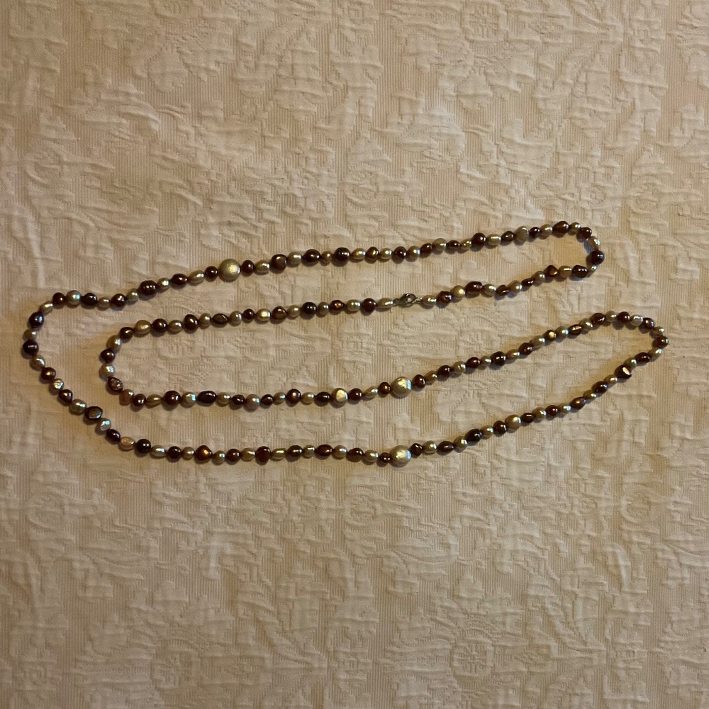 Stunning 54” strand of genuine freshwater pearls
